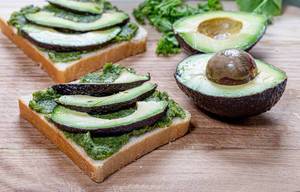 Two sandwiches with fresh avocado and greens. Healthy eating concept (Flip 2019)