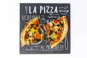 Two slices of a vegetable pizza on a pizzeria sign - with tomatoes. mushrooms spinach and peppers