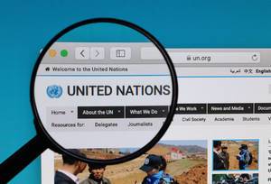 United Nations logo under magnifying glass