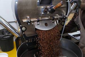 Unloading roasted coffee from the coffee roaster machine  (Flip 2019)