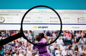 US Open logo on a computer screen with a magnifying glass