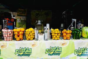 Various fruits on display on a lemon stand