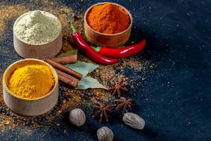 Various spices on black background