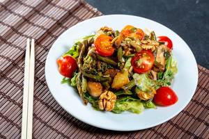 Vegan salad with fresh vegetables and grilled mushrooms