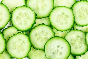 Vegetable background with sliced cucumbers (Flip 2020)