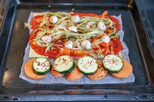 Veggie Pizza with zucchini and sweet potatoes in the oven