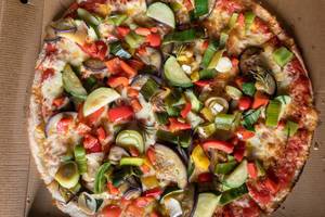 Veggie pizza with zucchini, eggplant, peppers and onions