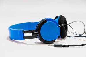 Vibrant blue headphones on white background