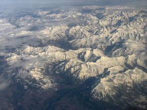 View at the Alps through an air plane window