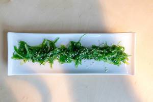 View from above on algae, rich in protein and vitamins, served as Goma Wakame salad, with healthy sesame seeds