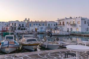 View of a harbour in front of the Greek village Limanaki-Naousa on Paros