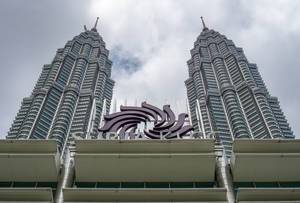 View of Petronas Twin Towers in front of the Entrance of Suria KLCC in Kuala Lumpur