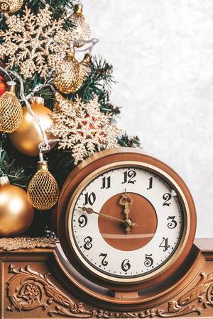 Vintage clock on background Christmas tree