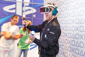 Visitor trying out the PlayStation VR set - Gamescom 2017, Cologne