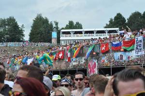 Visitors and flags in the background - Tomorrowland music festival 2014