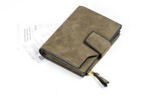 Wallet with receipts on a white background. Concept of monetary expenses, payment (Flip 2020)