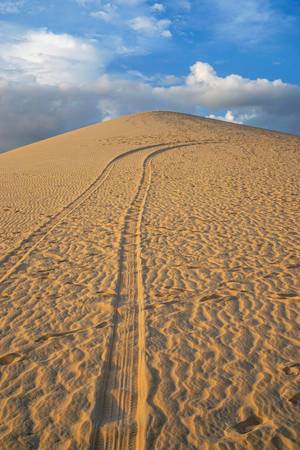 Wheel Tracks in the Sand leading to the Peak of the Mountain in Mui Ne, Vietnam