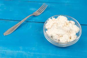 White-Cheese-in-the-bowl-on-the-blue-wooden-table.jpg