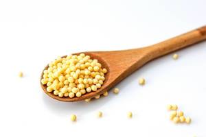 White Couscous in a Wooden Spoon