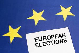 White paper with European elections text on European Union flag