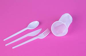 White plastic products on pink background