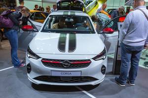 White small car with rally stripes: Opel Corsa remake exhibited at German car show IAA