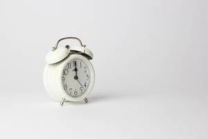White Vintage Timer Clock showing Midnight Time on White Background