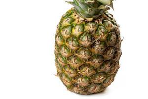 Whole Pineapple on the white background with copy space