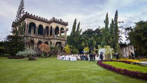 Wide shot of a garden wedding at The Ruins Mansion