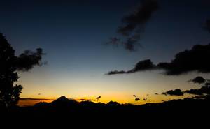 Wide view of colorful sunset behind Guatemala