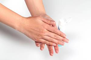 Woman hands treatment with antiseptic