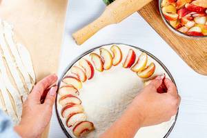 Woman-preparing-homemade-peach-pie.jpg