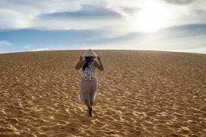 Woman with Vietnamese Hat in the Red Sand Dunes in Mui Ne, Vietnam  Flip 2019