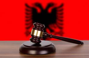Wooden gavel and flag of Albania