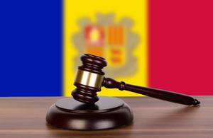 Wooden gavel and flag of Andorra