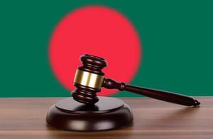 Wooden gavel and flag of Bangladesh