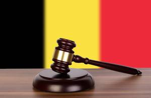 Wooden gavel and flag of Belgium