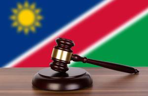 Wooden gavel and flag of Namibia