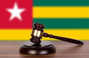 Wooden gavel and flag of Togo