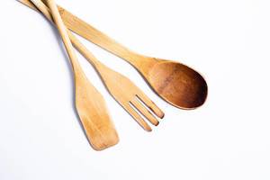 Wooden kitchen utensils - spoon, spatula on white background.jpg