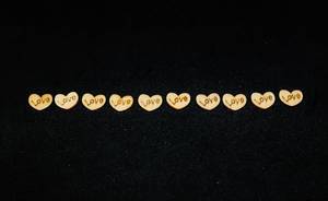 wooden love hearts on black background