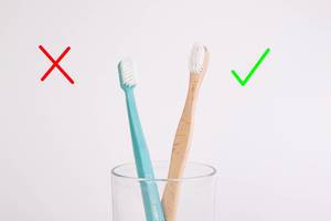 Wooden toothbrush. The creative concept of the ban plastic