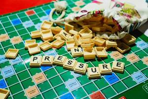 Word -Pressure- on spilled scrabble from pouch.jpg