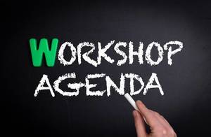 Workshop agenda text on blackboard