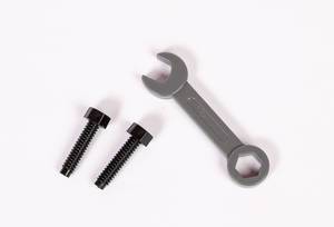 Wrench and bolts on white background