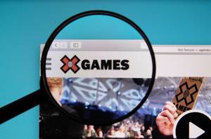 X Games logo on a computer screen with a magnifying glass