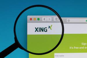 XING logo under magnifying glass