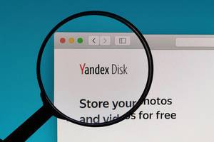 Yandex Disk logo under magnifying glass