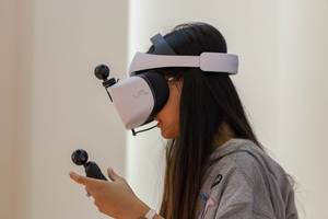 Young woman with a Huawei VR2 virtual reality headset