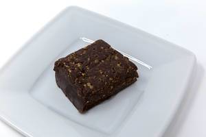 Yummy Scrummy - Raw Chocolate Brownie on white plate